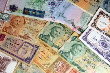 various old cash money banknotes from different countries of the world, stack of multiple currencies, pile of vintage retro bills of different origins with profiles of country leaders, ancient money