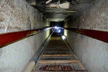 Narrow passge leading to the burial chamber inside the red north pyramid of Dahshur of king Sneferu, named for the rusty reddish hue of its red limestone stones, also called the bat pyramid