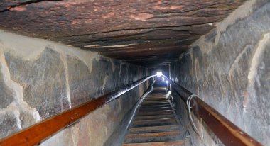 Narrow passge leading to the burial chamber inside the red north pyramid of Dahshur of king Sneferu, named for the rusty reddish hue of its red limestone stones, also called the bat pyramid