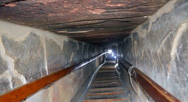 Narrow passge leading to the burial chamber inside the red north pyramid of Dahshur of king Sneferu, named for the rusty reddish hue of its red limestone stones, also called the bat pyramid