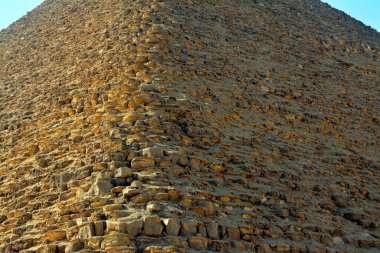 The red north pyramid of Dahshur of king Sneferu, named for the rusty reddish hue of its red limestone stones, also called the bat pyramid, it contains burial chambers, vintage retro ancient Egypt