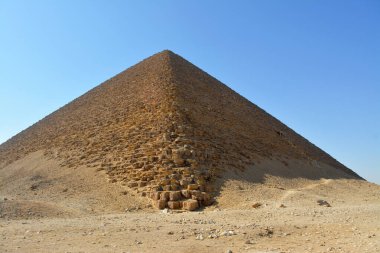 The red north pyramid of Dahshur of king Sneferu, named for the rusty reddish hue of its red limestone stones, also called the bat pyramid, it contains burial chambers, vintage retro ancient Egypt