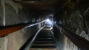 Narrow passge leading to the burial chamber inside the red north pyramid of Dahshur of king Sneferu, named for the rusty reddish hue of its red limestone stones, also called the bat pyramid