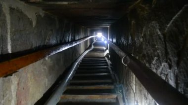 Narrow passge leading to the burial chamber inside the red north pyramid of Dahshur of king Sneferu, named for the rusty reddish hue of its red limestone stones, also called the bat pyramid