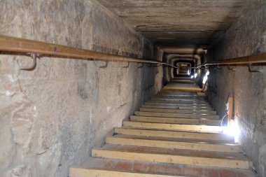 Giza, Egypt, January 26 2023: Details of the interior passages of The Bent Pyramid of king Sneferu, A unique example of early pyramid development in Egypt, madse of ancient limestone, selective focus