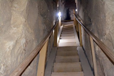 Giza, Egypt, January 26 2023: Details of the interior passages of The Bent Pyramid of king Sneferu, A unique example of early pyramid development in Egypt, madse of ancient limestone, selective focus