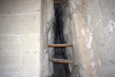Giza, Egypt, January 26 2023: Details of the interior passages of The Bent Pyramid of king Sneferu, A unique example of early pyramid development in Egypt, madse of ancient limestone, selective focus
