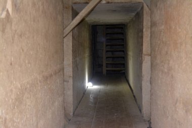 Giza, Egypt, January 26 2023: Details of the interior passages of The Bent Pyramid of king Sneferu, A unique example of early pyramid development in Egypt, madse of ancient limestone, selective focus