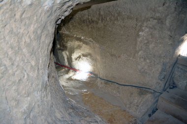 Giza, Egypt, January 26 2023: Details of the interior passages of The Bent Pyramid of king Sneferu, A unique example of early pyramid development in Egypt, madse of ancient limestone, selective focus