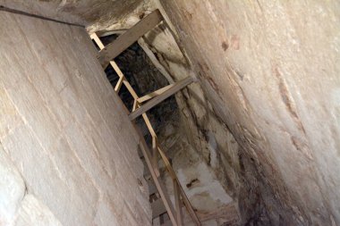 Giza, Egypt, January 26 2023: Details of the interior passages of The Bent Pyramid of king Sneferu, A unique example of early pyramid development in Egypt, madse of ancient limestone, selective focus