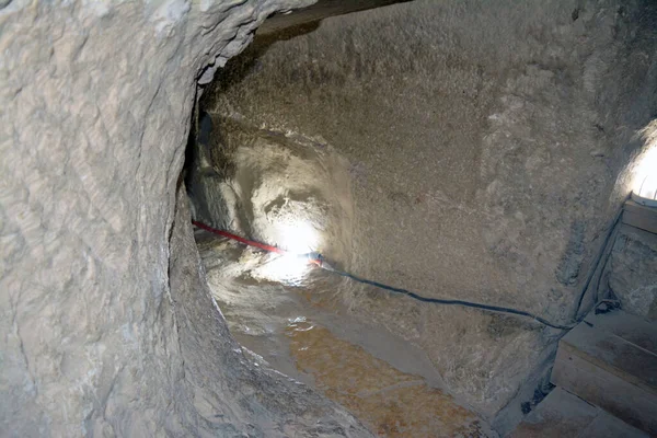 Giza, Egypt, January 26 2023: Details of the interior passages of The Bent Pyramid of king Sneferu, A unique example of early pyramid development in Egypt, madse of ancient limestone, selective focus