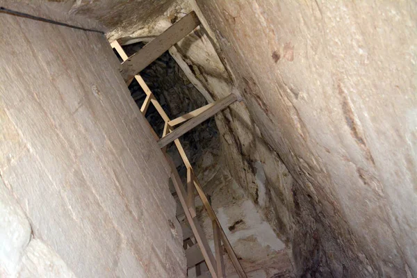 Giza, Egypt, January 26 2023: Details of the interior passages of The Bent Pyramid of king Sneferu, A unique example of early pyramid development in Egypt, madse of ancient limestone, selective focus