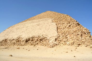 The Bent Pyramid of king Sneferu, A unique example of early pyramid development in Egypt located at Dahshur Badrashin Badrshein city, made of ancient limestone, height 104 meters, base 189 meters