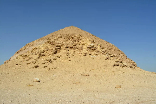 The satellite and the bent pyramids, Satellite one is located 55 meters south to the bent pyramid of king Sneferu, 26 meters in height and 52.80 meters in length and the bent\'s height is 104 meters