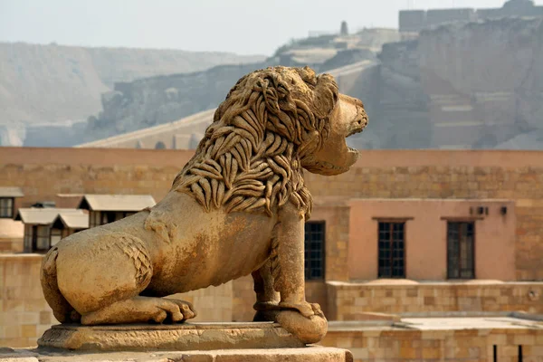Lion statue at the walls of The Citadel of Cairo or Citadel of Saladin, a medieval Islamic-era fortification in Cairo, Egypt, built by Salah ad-Din (Saladin), vintage retro ancient old travel concept