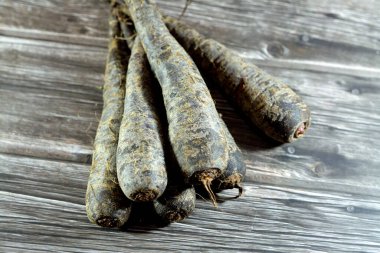 Black carrots, The carrot (Daucus carota subsp. sativus) is a root vegetable, typically orange in color, a biennial plant in the umbellifer family, Apiaceae. At first, it grows a rosette