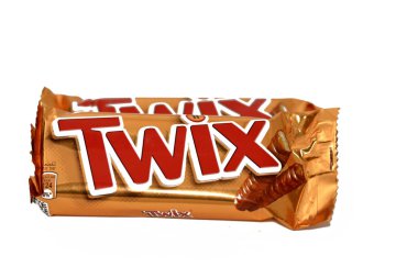Cairo, Egypt, February 5 2023: Twix caramel shortbread chocolate bar Mars Inc., a biscuit applied with other confectionery toppings and coatings (most frequently caramel and milk chocolate)