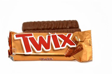 Cairo, Egypt, February 5 2023: Twix caramel shortbread chocolate bar Mars Inc., a biscuit applied with other confectionery toppings and coatings (most frequently caramel and milk chocolate)