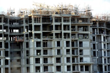 Giza, Egypt, February 4 2023: A construction site of new high rise in Egypt by Orascom construction Zed city Sheikh Zayed, new real estate Egyptian projects and new residential towers, selective focus