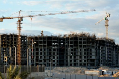 Giza, Egypt, February 4 2023: A construction site of new high rise in Egypt by Orascom construction Zed city Sheikh Zayed, new real estate Egyptian projects and new residential towers, selective focus