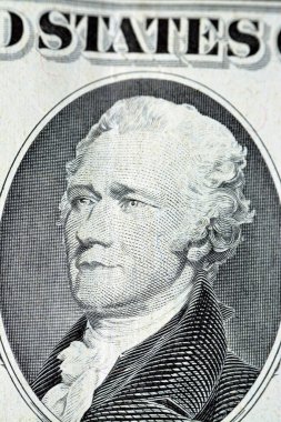 The portrait of Alexander Hamilton, who served as the first U.S. Secretary of the Treasury from the obverse side of old 10 $ ten American dollars bill banknote series 1988, old vintage American money