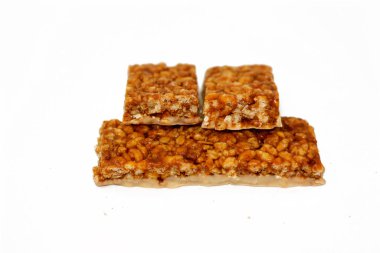 Granola bar with hazelnut cream, sweet sugary snack, sweetness and aromas of Apple Pie, selective focus of delicious candy of mixed granola and hazelnut