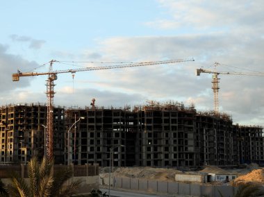 Giza, Egypt, February 4 2023: A construction site of new high rise in Egypt by Orascom construction Zed city Sheikh Zayed, new real estate Egyptian projects and new residential towers, selective focus
