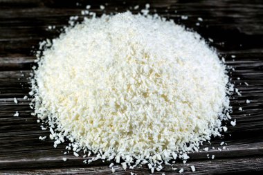 Shredded dried coconut fruit that is used in Ramadan month desserts and sweets bakery and in Yameesh compote that Muslims have on their breakfast of their fasting, Ramadan food background isolated