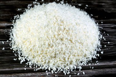 Shredded dried coconut fruit that is used in Ramadan month desserts and sweets bakery and in Yameesh compote that Muslims have on their breakfast of their fasting, Ramadan food background isolated