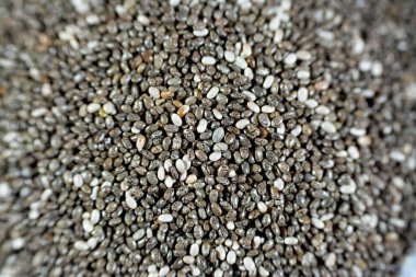Dried chia seeds with a high content of dietary fiber, vitamins, minerals, protein, fat and carbohydrates, rich in B vitamins, thiamin and niacin, it's edible seeds of Salvia hispanica of mint family