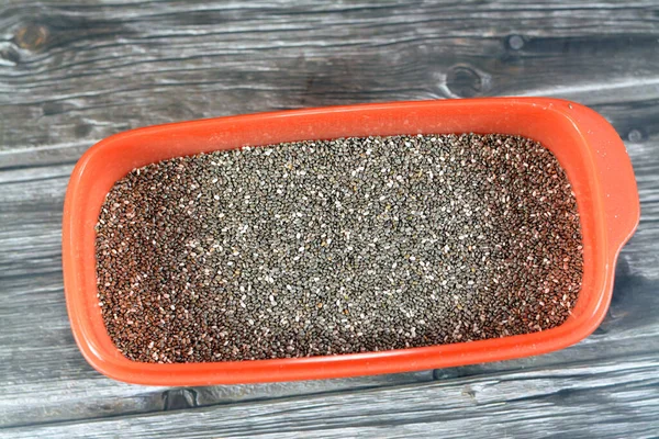 Dried chia seeds with a high content of dietary fiber, vitamins, minerals, protein, fat and carbohydrates, rich in B vitamins, thiamin and niacin, it\'s edible seeds of Salvia hispanica of mint family