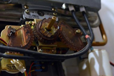 Cairo, Egypt, February 25 2023: A gas water heater is a tank that heats water from a gas-fired burner located at the bottom of the tank, uses the heat from burning a fuel (usually natural gas)