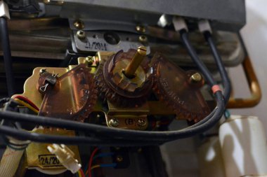 Cairo, Egypt, February 25 2023: A gas water heater is a tank that heats water from a gas-fired burner located at the bottom of the tank, uses the heat from burning a fuel (usually natural gas)