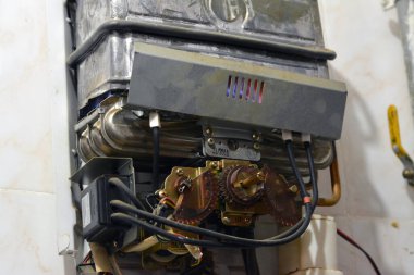 Cairo, Egypt, February 25 2023: A gas water heater is a tank that heats water from a gas-fired burner located at the bottom of the tank, uses the heat from burning a fuel (usually natural gas)