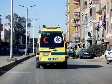 Giza, Egypt, January 26 2023: Ambulance on road responding for an emergency call of road accidents, Translation of Arabic text (ministry of health, Egyptian ambulance organization), selective focus