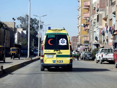 Giza, Egypt, January 26 2023: Ambulance on road responding for an emergency call of road accidents, Translation of Arabic text (ministry of health, Egyptian ambulance organization), selective focus