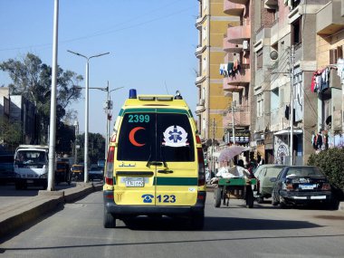 Giza, Egypt, January 26 2023: Ambulance on road responding for an emergency call of road accidents, Translation of Arabic text (ministry of health, Egyptian ambulance organization), selective focus