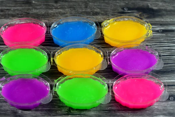 Colorful non-toxic viscous, squishy and oozy green or other color material made primarily from guar gum or guaran which is a galactomannan polysaccharide extracted from guar beans, children toy time