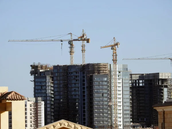 stock image Giza, Egypt, March 10 2023:  zed city By Orascom Construction company, buildings, high rise of new residential flats in Sheikh Zayed city with tower cranes and skyscrapers, selective focus