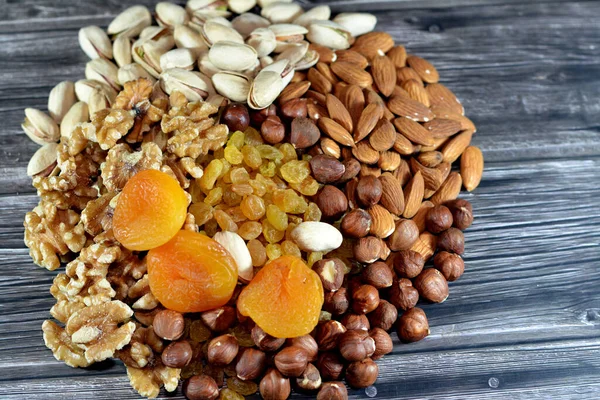 Mixture of various types of nuts, Pistachios, hazelnuts, almonds, walnuts, raisins, dried apricot, used in baking and desserts and could be eaten raw, contain vitamins and minerals and used in Ramadan