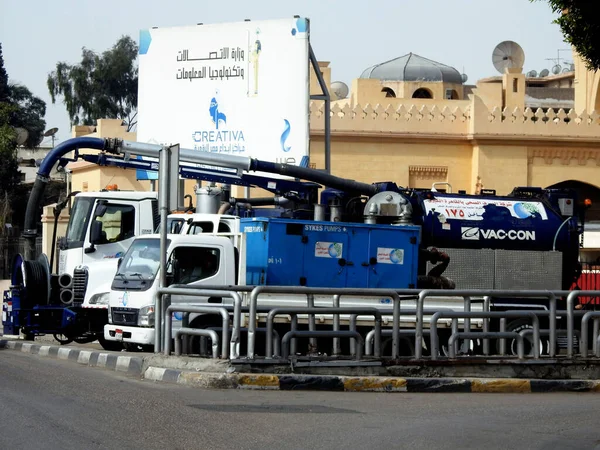 stock image Cairo, Egypt, March 25 2023: large drainage pump vehicles ready to drain expected heavy rain that may flood the streets, equipped with drainage pump, control panel, engine generator, and drainage hose