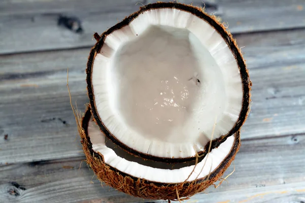 Coconut fruit cocoanut (Cocos nucifera) of the palm tree family (Arecaceae), genus Cocos, botanically is a drupe, not a nut, provides food, fuel, cosmetics, folk medicine and building materials