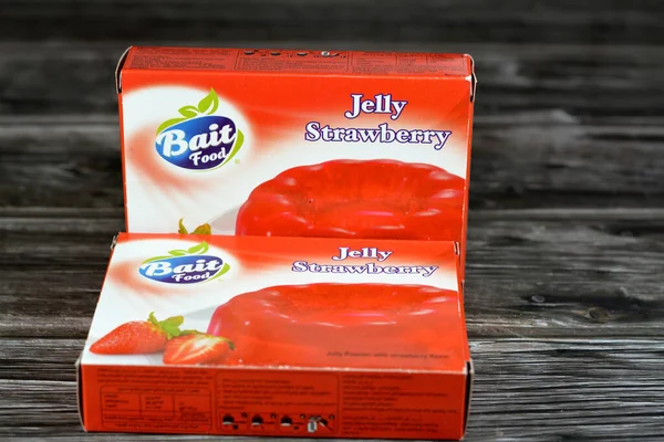 stock image Cairo, Egypt, April 28 2023: Bait food Jelly strawberry pack, sweet red jelly pudding strawberry flavored, selective focus of chilled red strawberry jelly dessert, Gelatin desserts