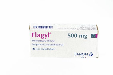 Cairo, Egypt, May 4 2023: Flagyl metronidazole 500mg tablets,  Amebicides, an antibiotic that is used to treat bacterial infections of the vagina, stomach, liver, skin, joints, brain and spinal cord