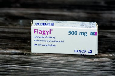 Cairo, Egypt, May 4 2023: Flagyl metronidazole 500mg tablets,  Amebicides, an antibiotic that is used to treat bacterial infections of the vagina, stomach, liver, skin, joints, brain and spinal cord