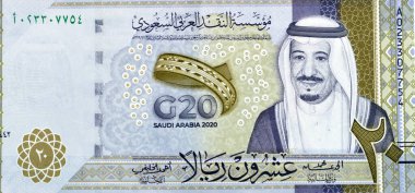 20 SAR 20 Suudi Arabistan Riyals 'ın ters tarafının büyük bir parçası banknot para banknotu Kral Salman' ın portresi ile hatıra sayısı, Krallığın G20 zirvesinin 3D logosu