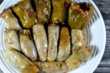 bell peppers stuffed Egyptian mahshi and Eggplants white aubergine Mahshy filled with white rice, onion, parsley, dill and coriander, selective focus of Arabic Egyptian traditional cuisine of Mahshy