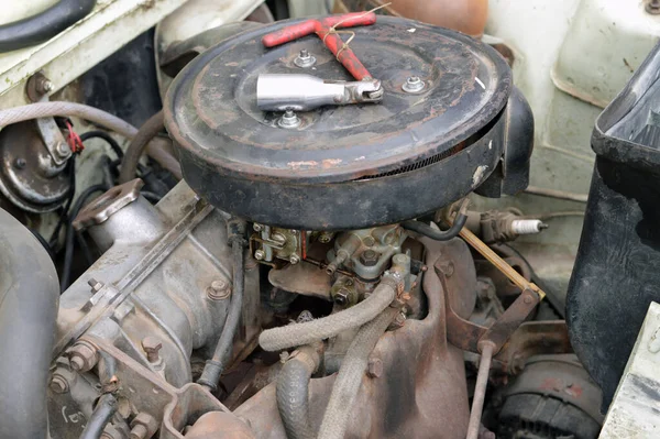 maintenance of an old automobile car, replacements of some car components like spark plug, maintenance service for radiator, distributor, engine, air filter, alternator, old vintage retro car services