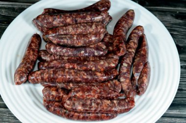 Middle Eastern raw fresh beef sausage, Egyptian sausages. it is a dry, spiced sausage either beef or lamb consumed in Middle East, uncooked meat ready to be cooked in different Eastern cuisines clipart