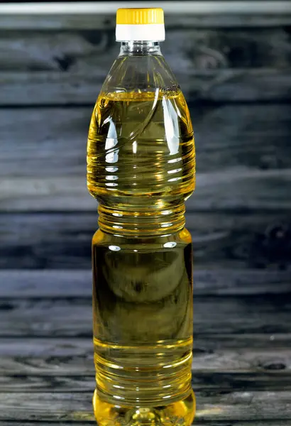 Food oil that is of mixture of sunflower, corn, soybean and natural oil that has multi uses in kitchen in cooking various food and in frying many cuisines, table oil in a bottle, selective focus
